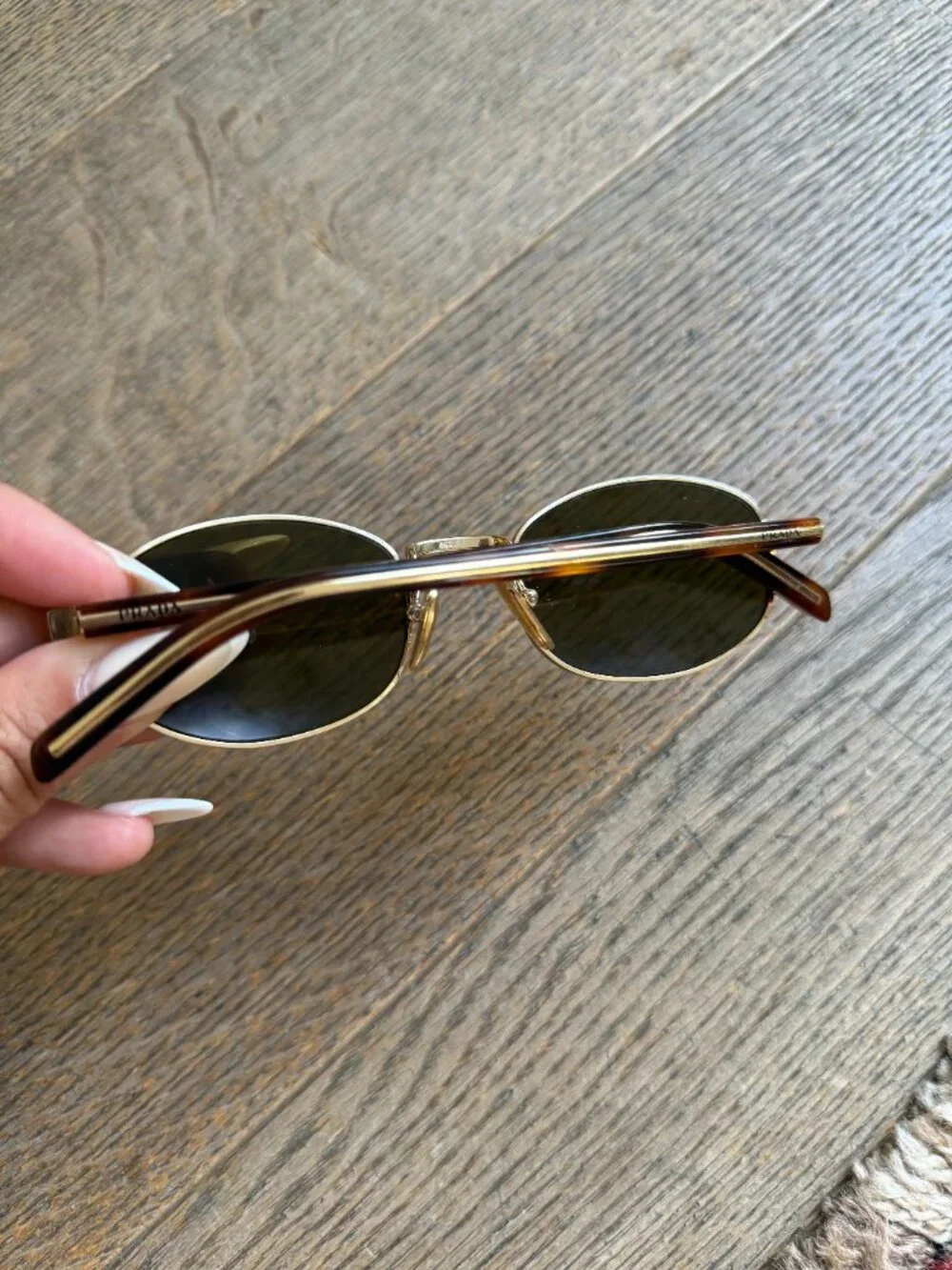 Prada PR oval sunglasses in gold with brown lenses